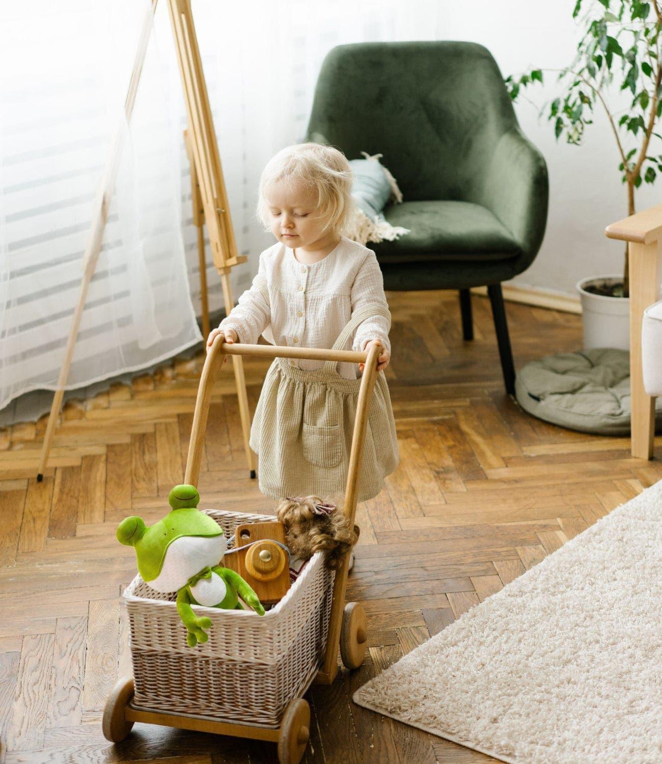 🚗 Children happily pushing a toy-filled cart, with the delightful Frog Plush Toy among them.